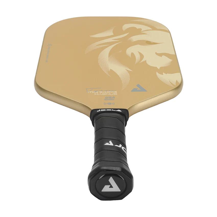 A triangular-shaped, gold-colored pickleball paddle with an intricate floral design on the face. The handle features a black grip with the Pickleball Zone logo at the end. This TYSON MCGUFFIN MAGNUS CAS 14MM model embodies elegance and performance, perfect for players aspiring to match Tyson McGuffin's prowess.