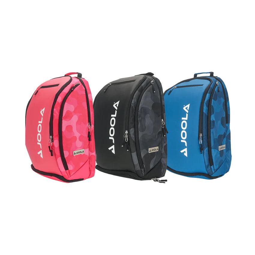 Three JOOLA Vision II Deluxe Pickleball Backpacks from Pickleball Zone are displayed in red, black, and blue colors. Each backpack features a camo pattern and the brand name "JOOLA" printed vertically in white on the left side. Designed for on-the-go players, these backpacks offer ultimate storage with accessible front and side zippers.