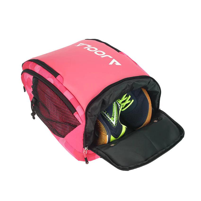 A Pickleball Zone JOOLA Vision II Deluxe Pickleball Backpack, in pink and partially unzipped to reveal sneakers inside. Perfect for on-the-go players, it features a black mesh side pocket and a white logo on the top flap, offering ultimate storage.