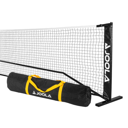 An Elemental Net from Pickleball Zone, featuring a black net with white edges and two black posts adorned with the Pickleball Zone logo in white. Below the regulation-height net is a cylindrical, lightweight, and portable black carrying bag with yellow straps, also branded with the Pickleball Zone logo in white.